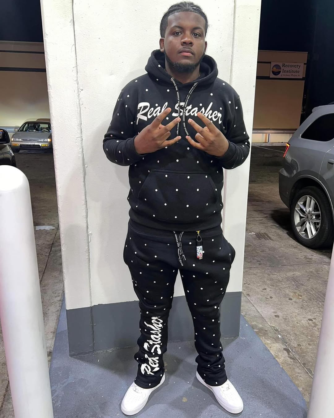 Allover printing sweatsuit with a matching hoodie and jogger pants featuring a continuous bold pattern.