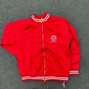 Red polyester tracksuit featuring a matching jacket and pants designed for comfort and everyday wear.