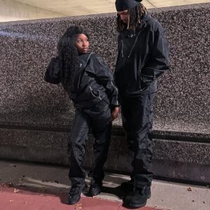 Windbreaker tracksuit with lightweight jacket and matching pants for sporty casual wear