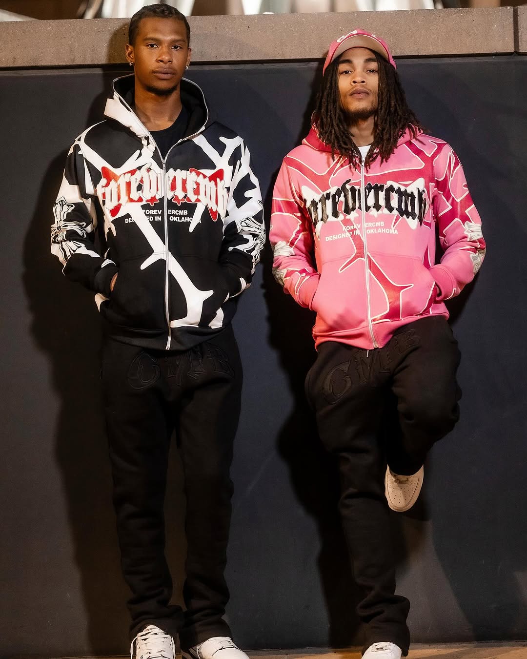 Full zip-up hoodie with adjustable hood and front pockets in a casual athletic style